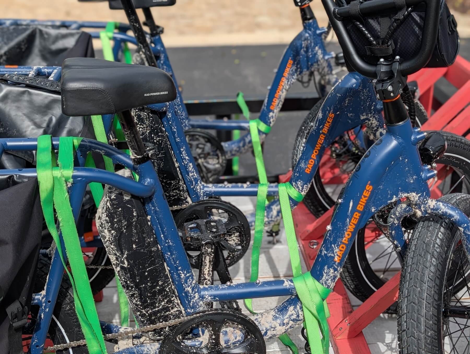 Fleet bikes caked in sand after a ride on the beach